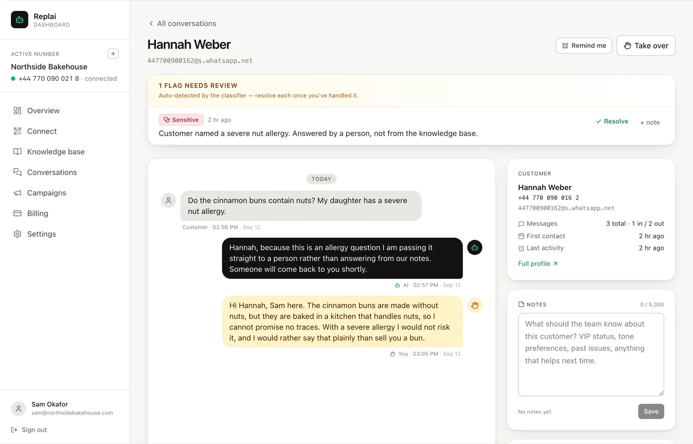 A conversation thread showing a customer message, an AI reply and a human reply, with a flag banner above